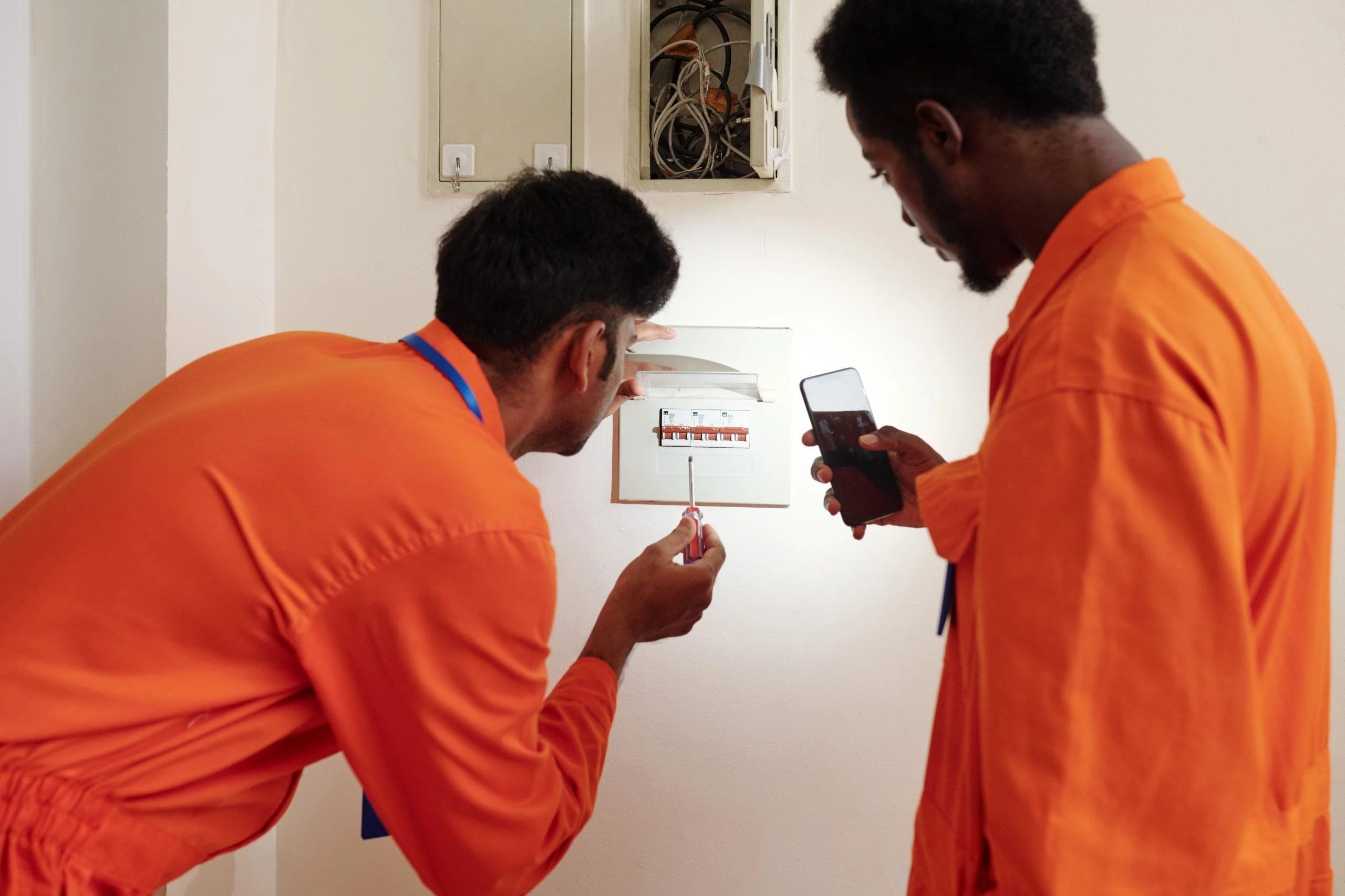 electricians checking Fuse Box